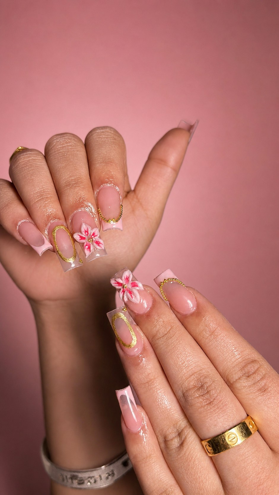 Blush square nails with sculpted flowers and gold details